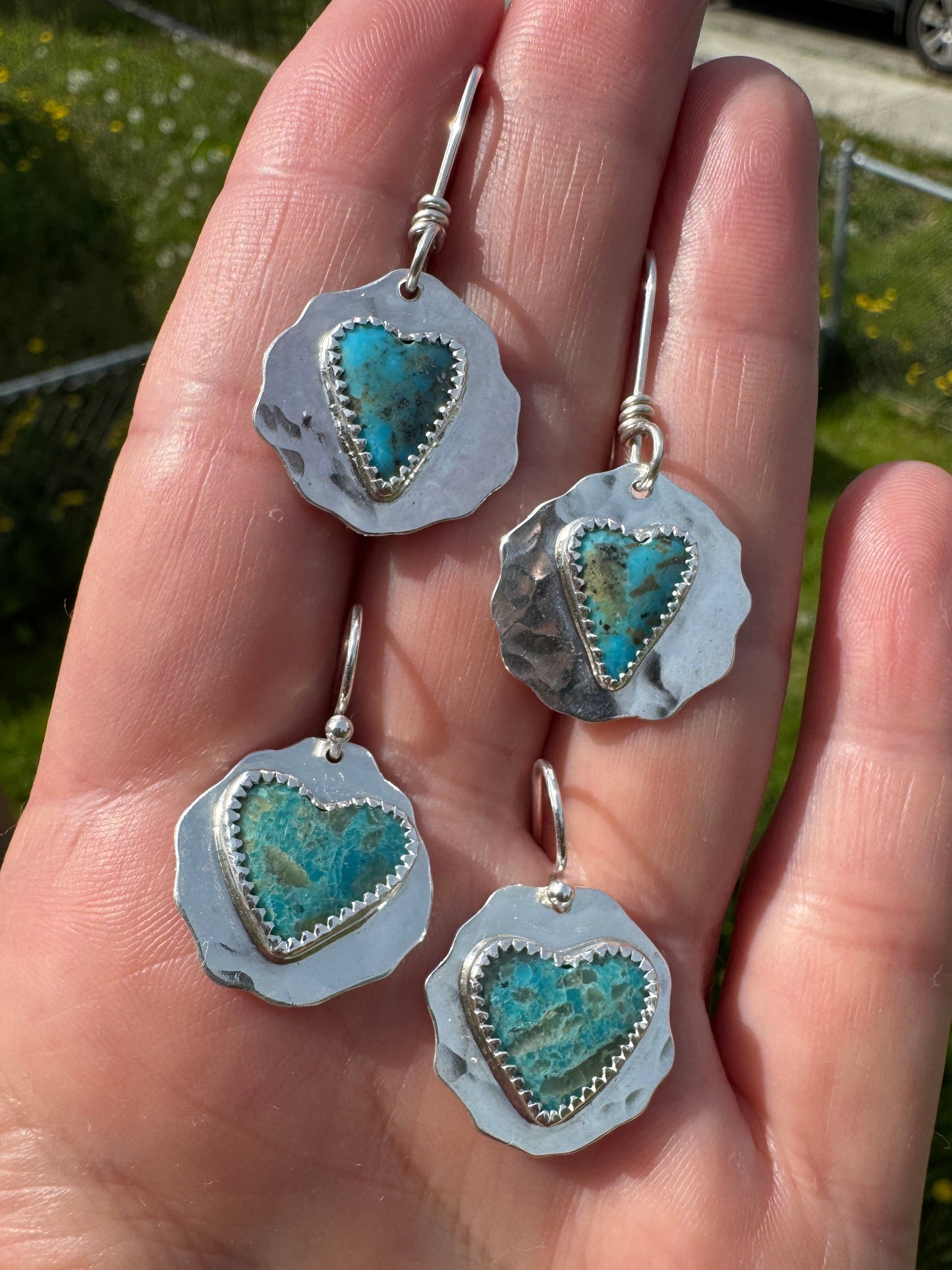 Shows both pairs of Kingman wild heart earrings