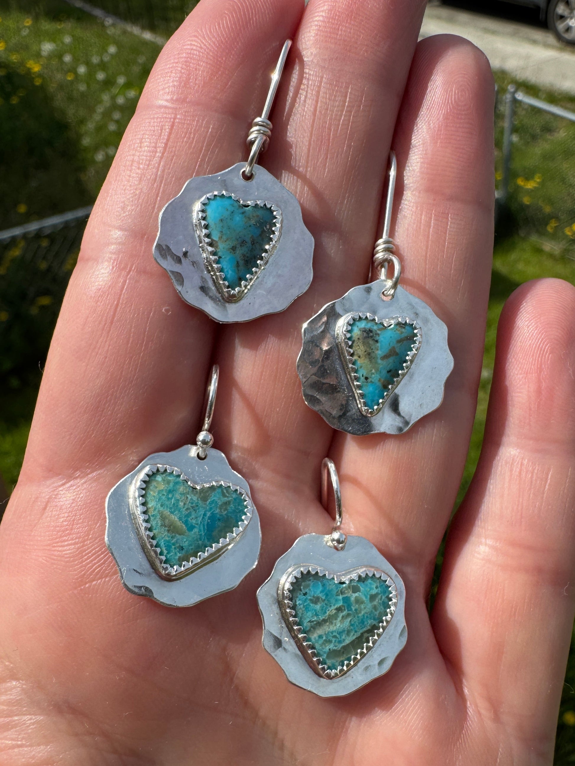 Shows both pairs of Kingman wild heart earrings