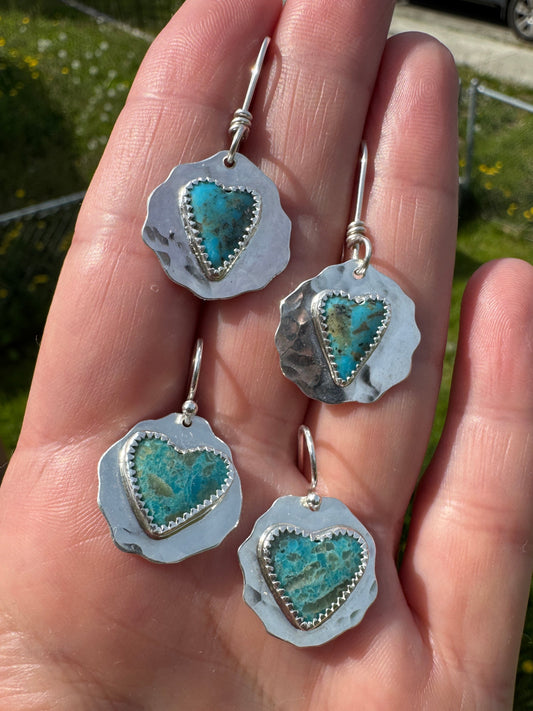Shows both pairs of Kingman wild heart earrings