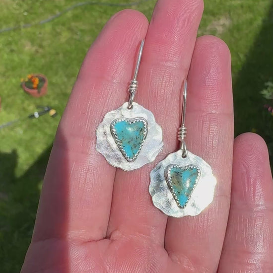 Video of slim heart-shaped Kingman turquoise bezel set in sterling silver on my hand showing them dangling. 